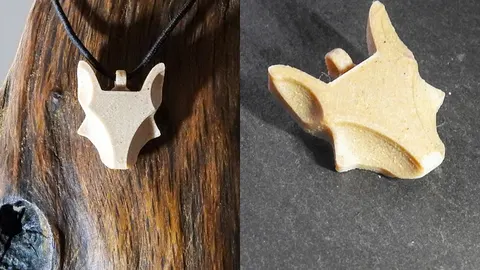 3D-printed fox head pendant on a cord, and a close-up of the pendant