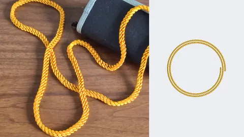 Gold 3D-printed Cuban link chain necklace on a table, beside a render of the coiled chain