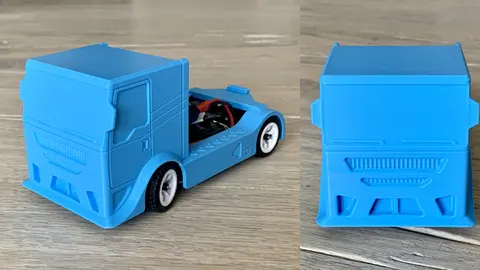 A blue 3D-printed 1/28 race truck body with a sculpted grille on a WLtoys K989 RC chassis, seen from the side and the front
