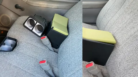 3D-printed center console and cup holders installed on the bench seat of a Chevy S10 pickup